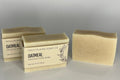 Three bars of Oatmeal soap from High Plains Soap Co on a gray background