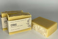 Two bars of soap from High Plains Soap Co on a gray background