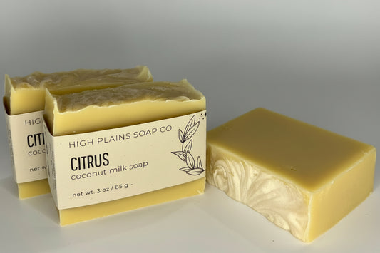 Two bars of soap from High Plains Soap Co on a gray background