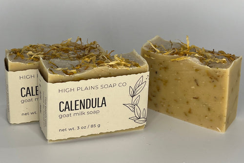 Three bars of soap on a gray background