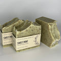 Three bars of speckled green and brown soap
