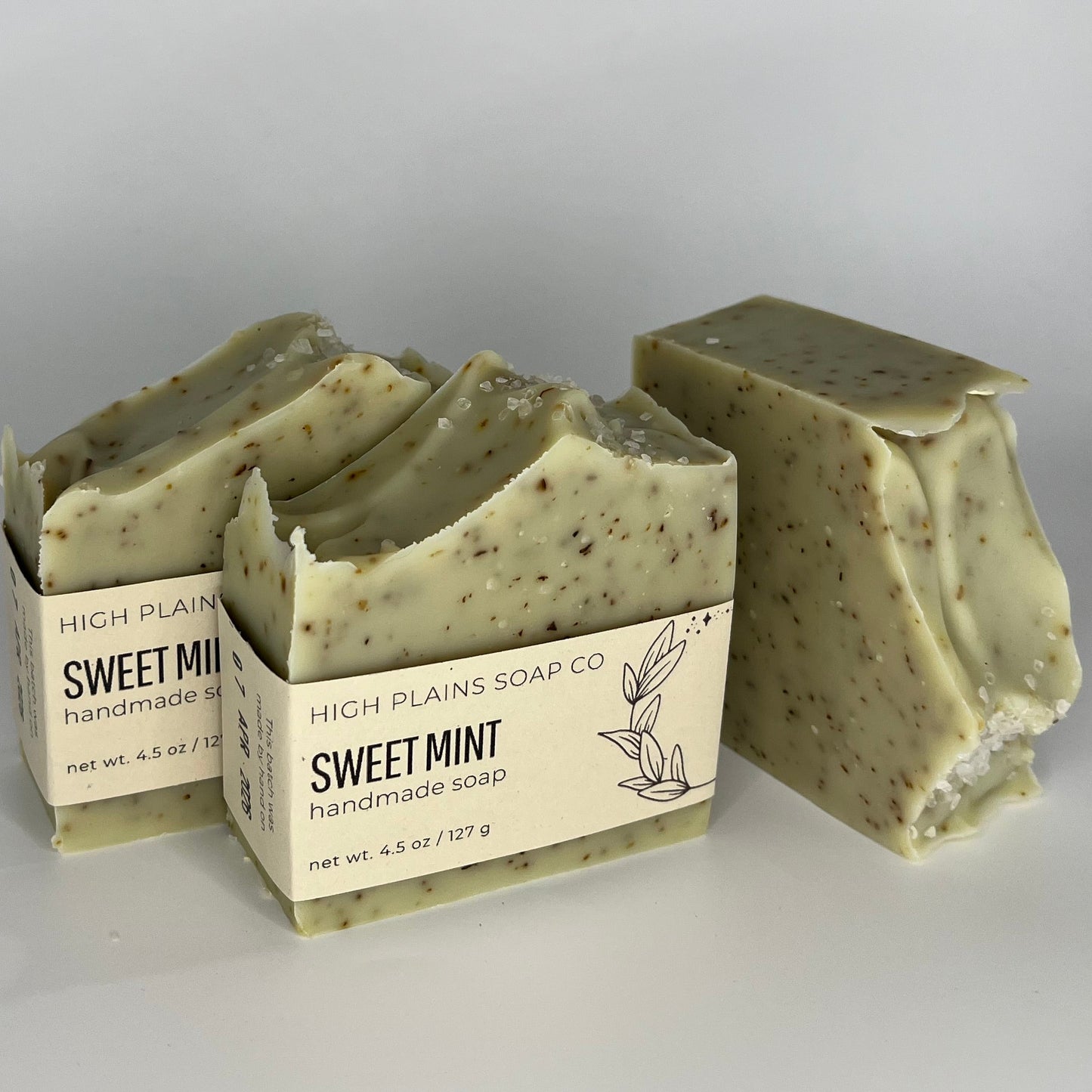 Three bars of speckled green and brown soap