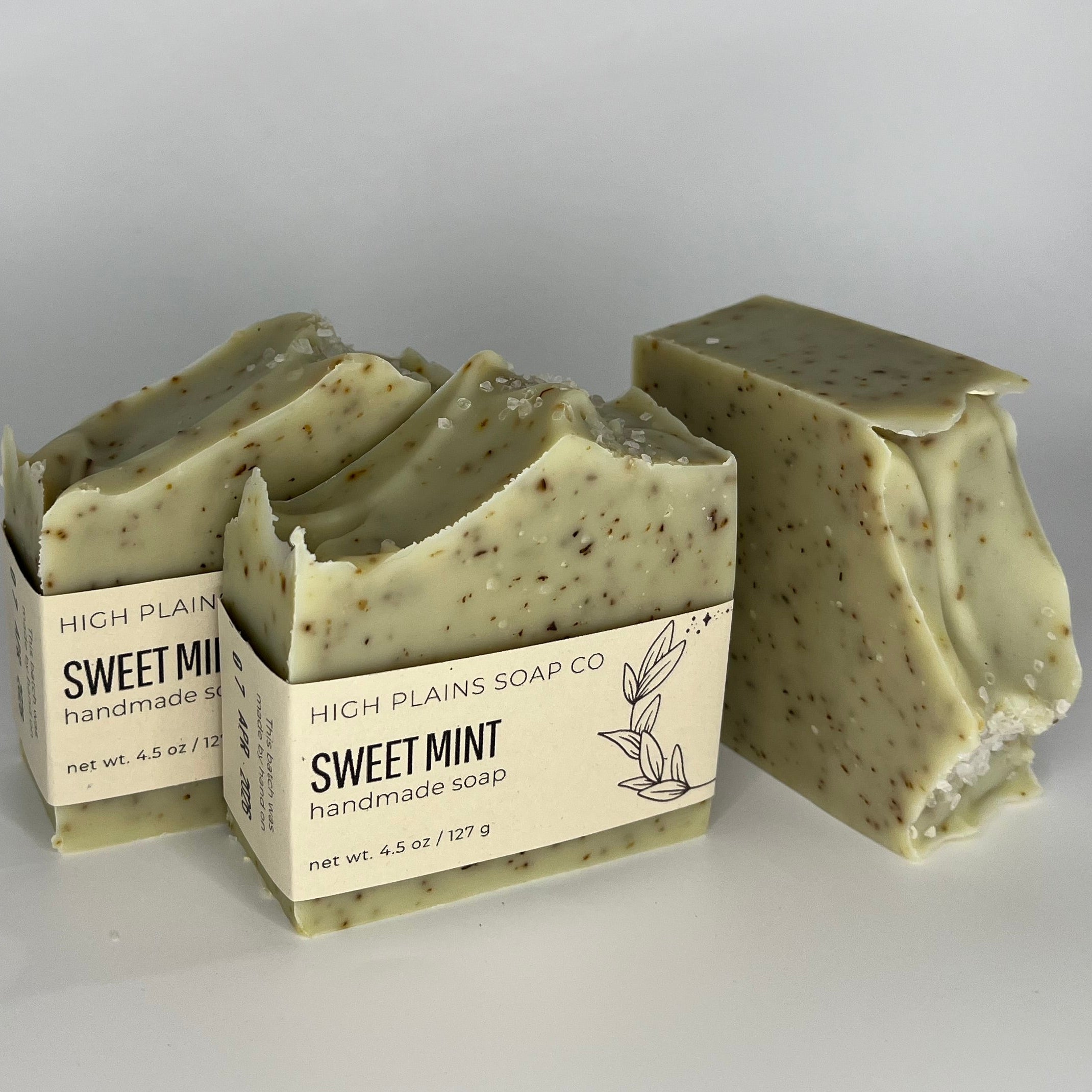 Three bars of speckled green and brown soap